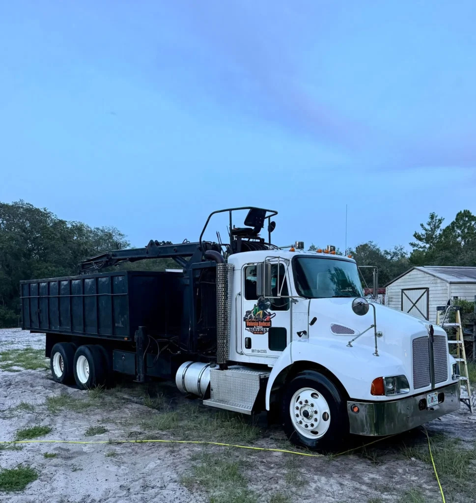 Volusia Grapple grapple truck parked in Volusia County, Florida, supporting sustainable tree services and land